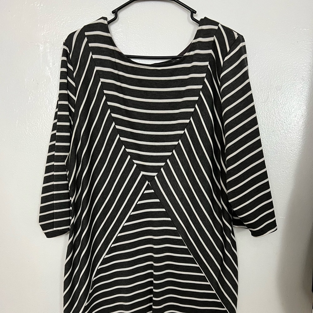 This is a grey and white stripped dressed. Gently used and worn twice. Size 18